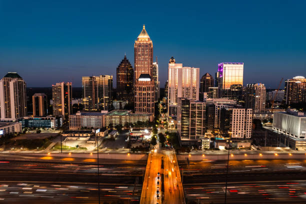busy highway surrounds the Atlanta skyline at night