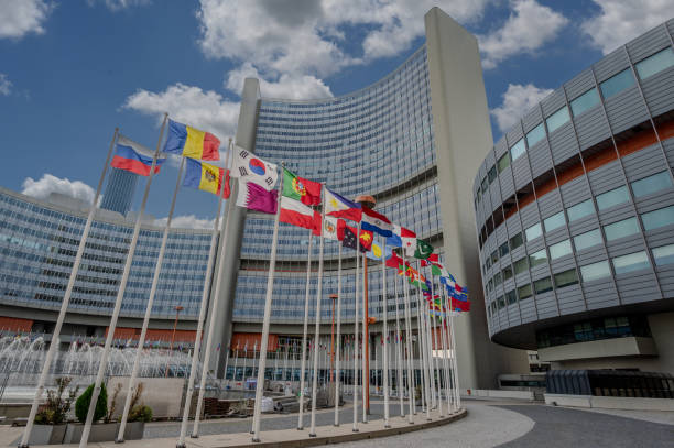 istock Vienna, Austria, August 17,2022. The United Nations headquarters. Flags fly slowly, iconic image with wide angle lens and low angle view. Beautiful summer day. 2157371804