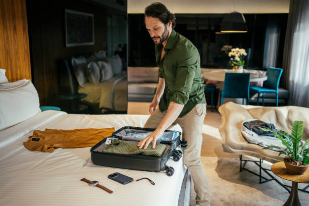 istock Businessman arriving at hotel room 2157374505