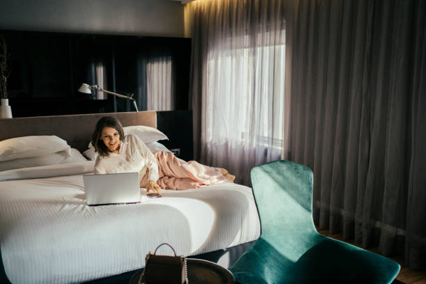 istock Businesswoman working at hotel bedroom 2157374508