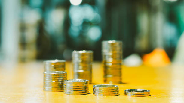 Coins stack. Concepts of the banking system, rising interest rates, inflation, deflation, and savings.