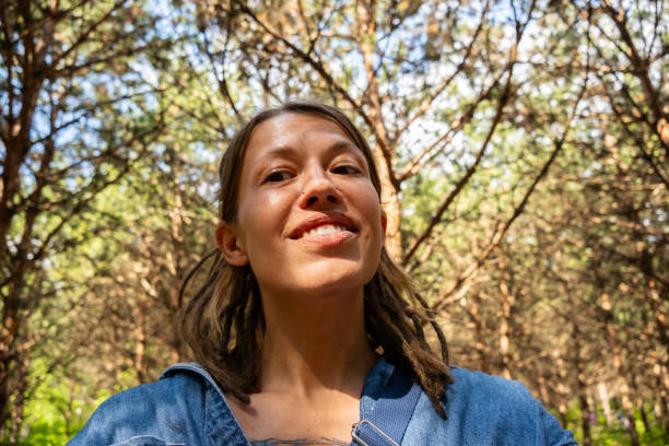 istock Smiling woman in the summery pine forest. 2157374942