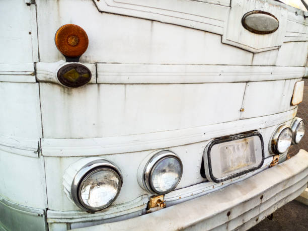 Front End Of An Old White Bus - Old White Transport Bus. Front end of a old transportation bus.