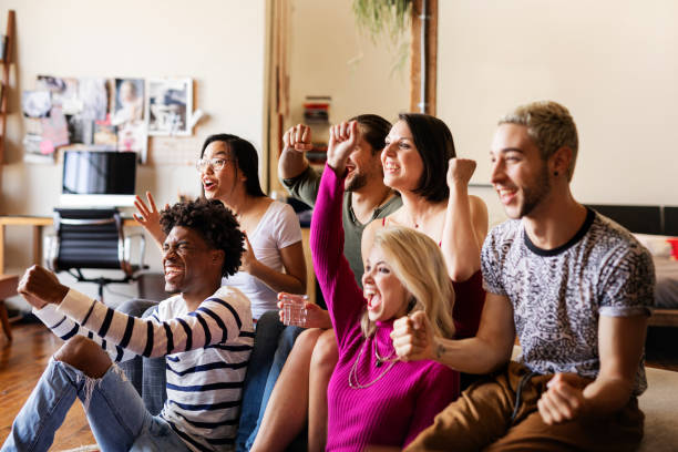 istock Friends watching a game show on the tv 2157376394