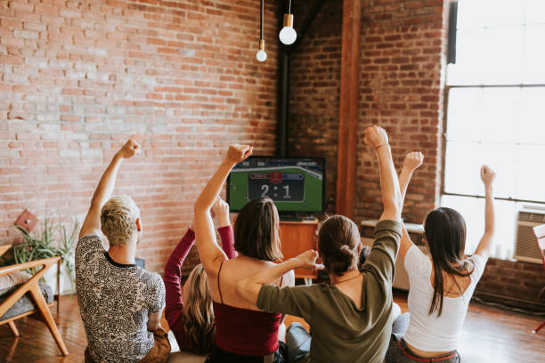 istock Friends watching a game show on the tv 2157376647