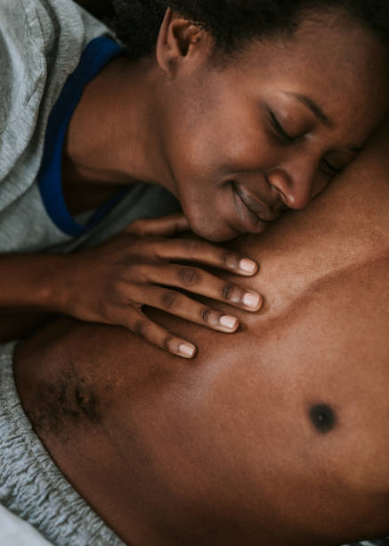 istock Happy black couple hugging in bed 2157376734
