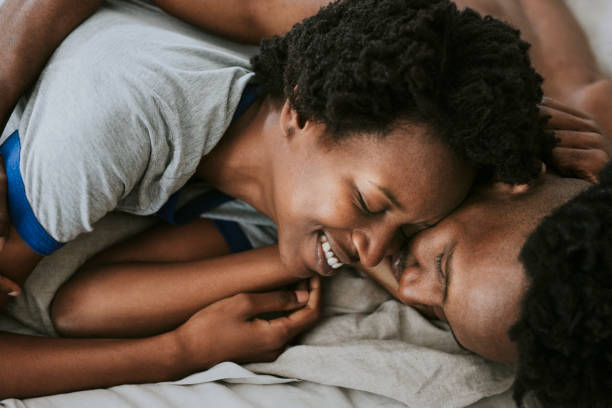 istock Cute happy black couple playing in bed 2157376809