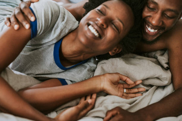 istock Cute happy black couple playing in bed 2157376813