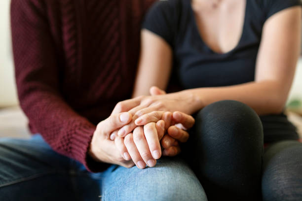 istock Passionate couple holding hands in bed 2157376949