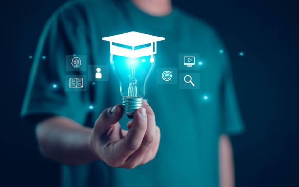 istock Male graduate diploma course holding a light bulb 2157376989
