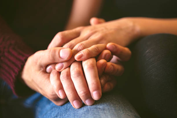 istock Sweet couple holding hands close up 2157377034