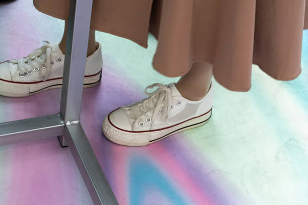 Girl wears new canvas shoes