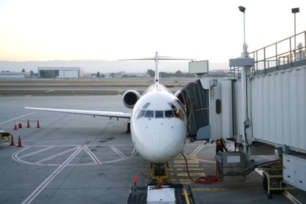 istock close up on airplane at the gate bridge 2157379568