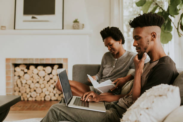 istock Black people in the living room using a laptop 2157379658
