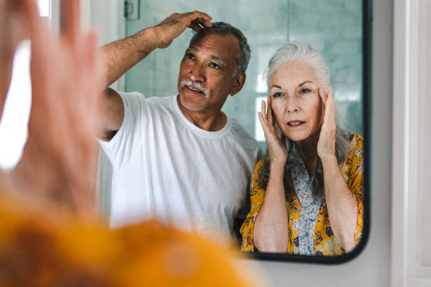 istock Elderly couple in front of a mirror 2157379972