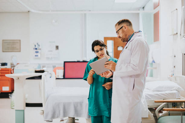 istock Doctor and nurse discussing a medical case 2157380153