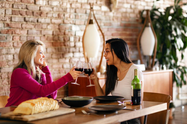 istock Friends making a toast at a dinner party 2157380240