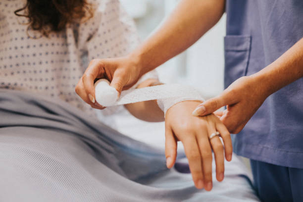 istock Nurse bandaging the patients arm 2157380987
