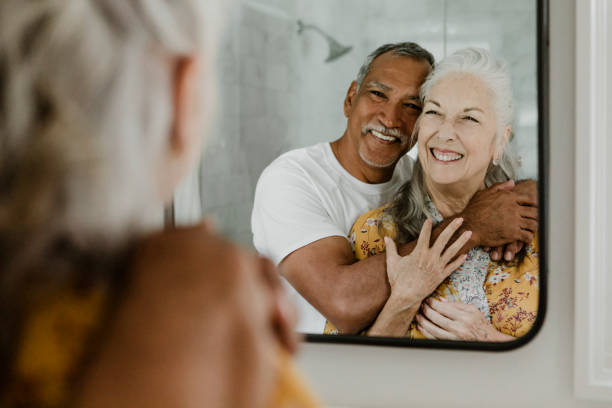 istock Elderly couple in front of a mirror 2157381003