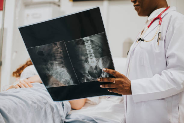 istock Physician showing a patient the X-ray results 2157381481