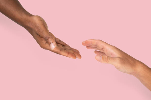 istock Helping hands reaching charity gesture 2157381563