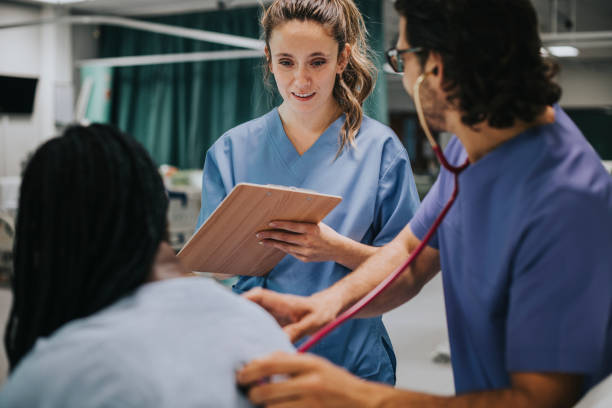 Young male physician examining a patient