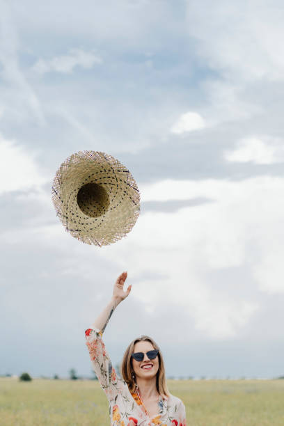 istock Woman throwing hat into the air 2157382476