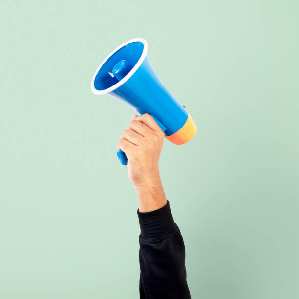 istock Hand holding megaphone marketing announcement campaign 2157382524
