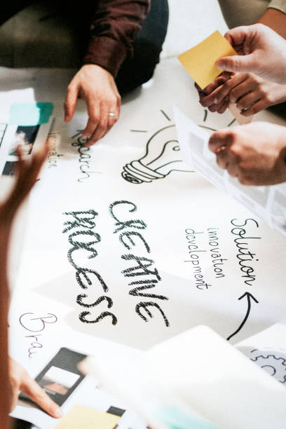 istock Business people brainstorming management process on paper 2157383233
