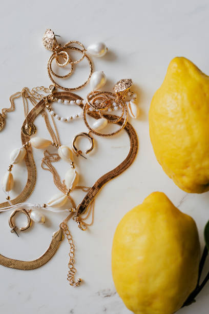 istock Fresh lemons by the gold jewelries 2157383375