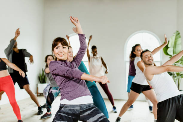istock Sportive people dancing in a gym 2157383733