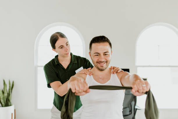 istock Injured man with a physical therapist 2157383757