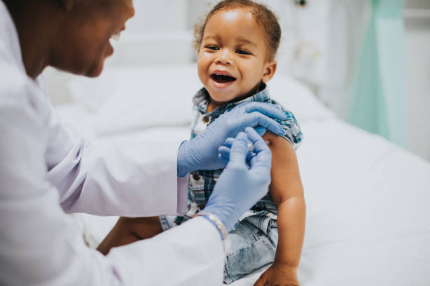 istock Toddler getting a vaccination by a pediatrician 2157383841