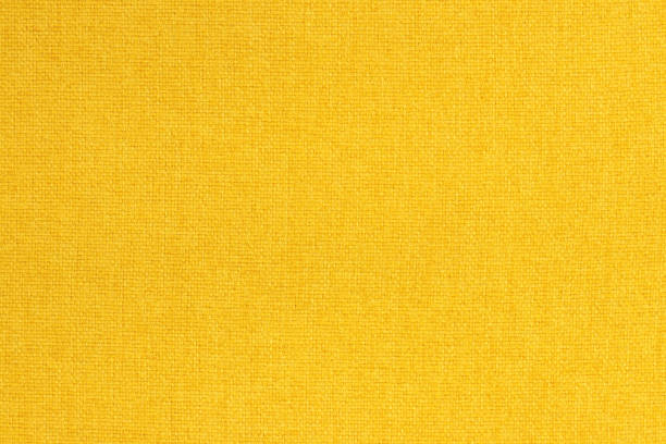 istock Yellow golden cotton fabric texture background, seamless pattern of natural textile. 2157383894