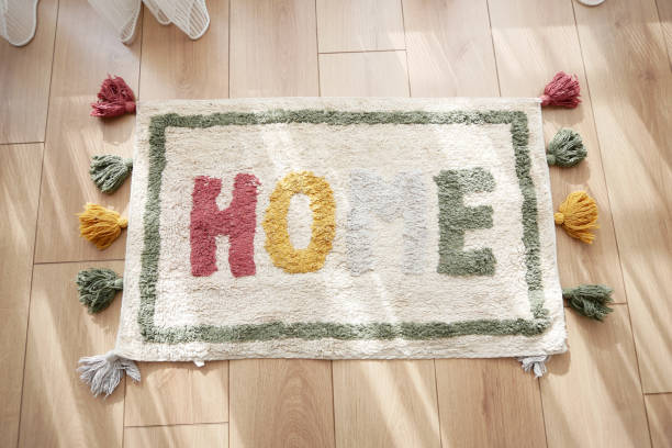 istock a rug with the word home written on it is on the floor in a hallway 2157384247