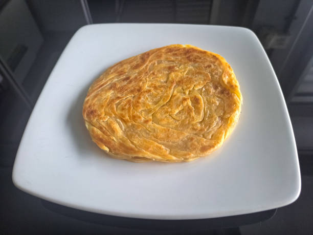 Tasty Roti Canai Or Parata Bread On A Plate. Food Menu.