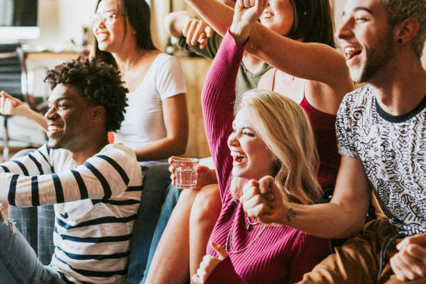 istock Friends watching a game show on the tv 2157384501