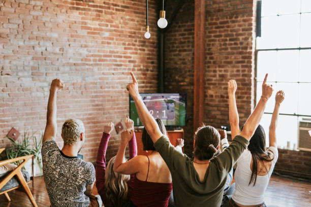 Friends watching a game show on the tv