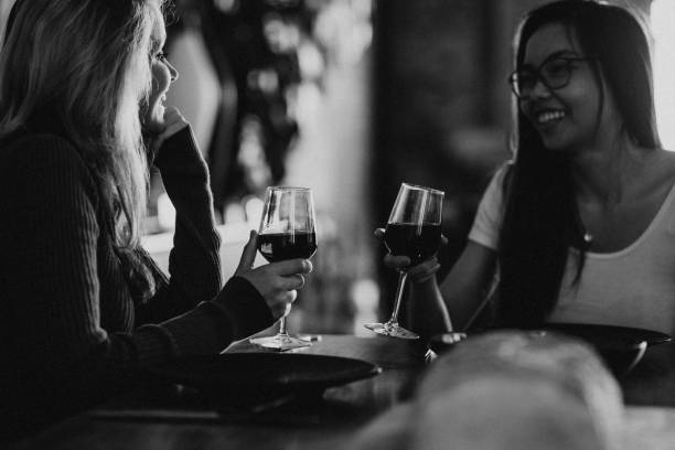 istock Friends having red wine at a dinner party 2157384543