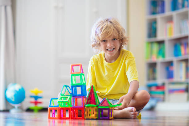istock Child playing with magnetic building blocks. 2157384904