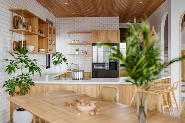 istock Lush Sunny Modern Kitchen Interior with Breakfast Area and Nature Views 2157387217