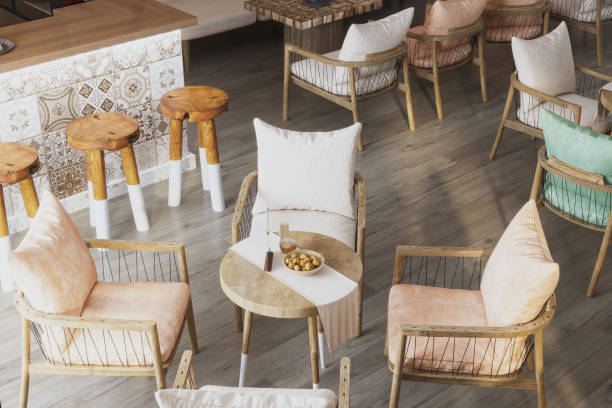 istock The main hall with wooden tables, and setting sofas in the cafe 2157387487