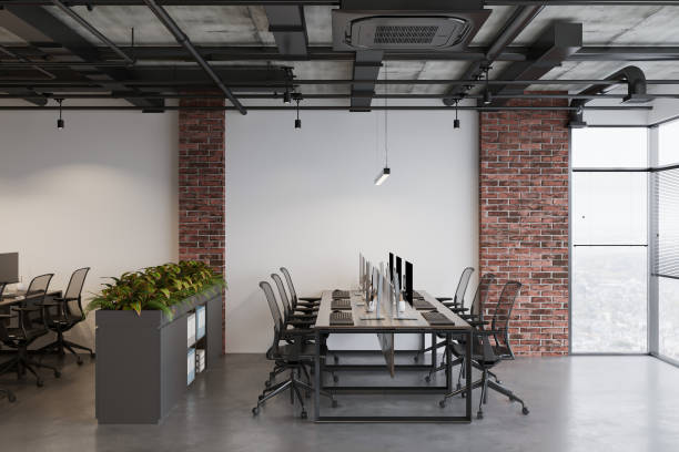 istock Working area in modern office with concrete floor in industrial loft style with sunlight 2157387546