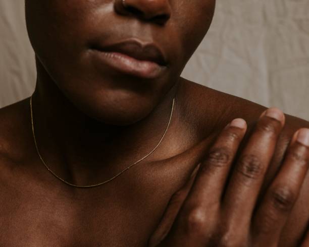 istock African woman, bare shoulders closeup photo 2157387681