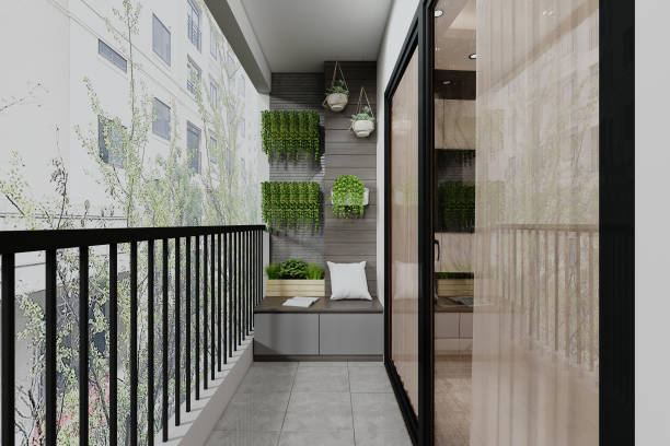 istock Small clean cozy balcony decorated with greenery and a bench with pillows 2157387976