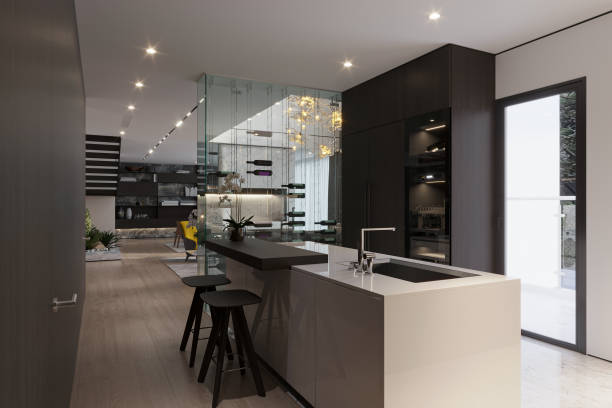 istock A sleek and modern kitchen with dark cabinetry and sleek appliances, accented with statement lighting. 2157387997