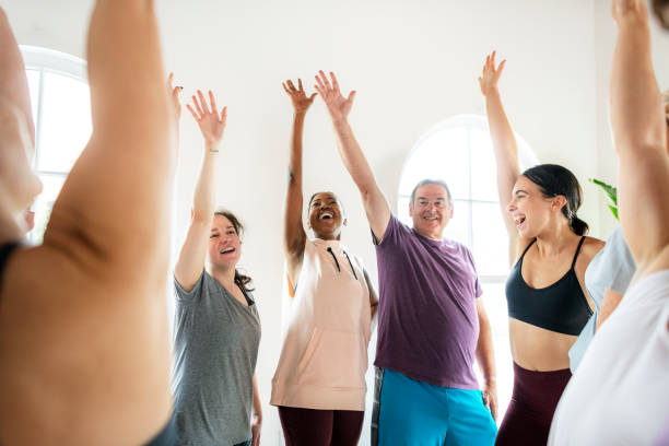 istock Group of people doing full body stretching in a class 2157388210