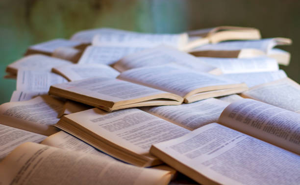 hundreds of open books on an old table Ready for the fall schools