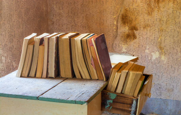 istock old books on an old table in an old house 2157388312