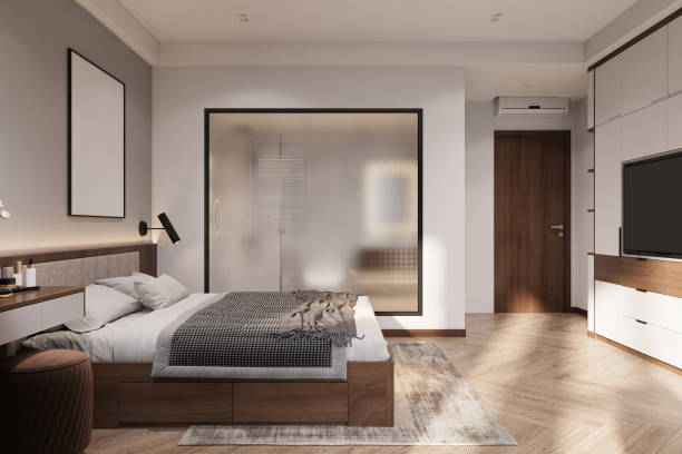 istock luxury comfortable double bed with pillows and plaid, mock-up frame on the bedhead. 2157389740